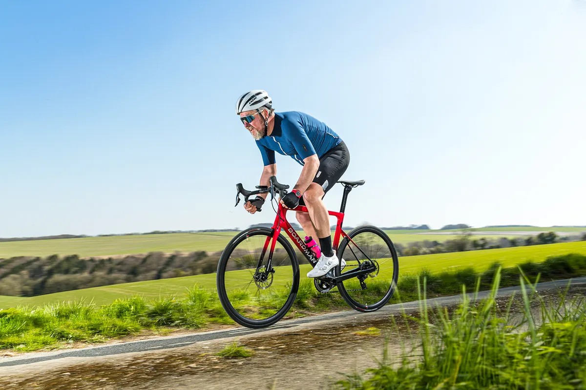 Cyclist in blue top riding the Boardman SLR 9.4 AXS Disc Carbon - BikeRadar BOTY 2021