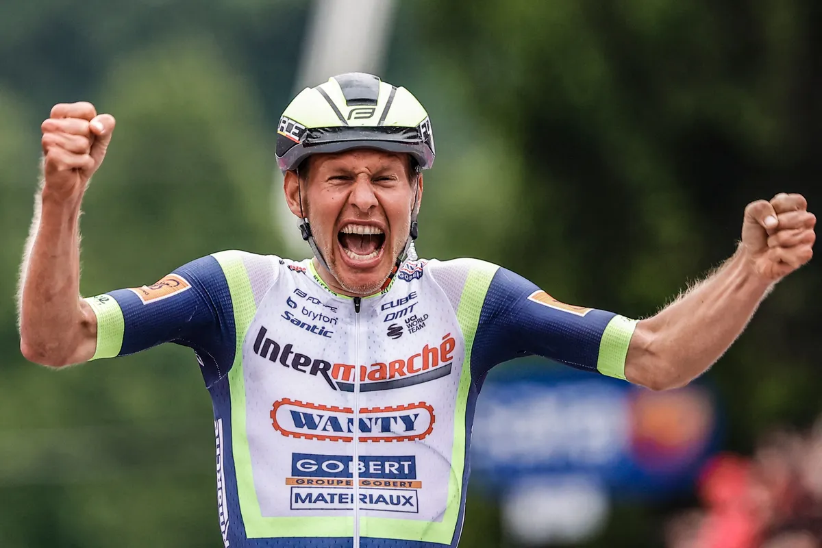 TOPSHOT - Team Wanty rider Netherlands' Taco Van der Hoorn reacts as he crosses the finish line to win the third stage of the Giro d'Italia 2021 cycling race, 190 km between Biella and Canale, Piedmont, on May 10, 2021. (Photo by Luca Bettini / AFP) (Photo by LUCA BETTINI/AFP via Getty Images)