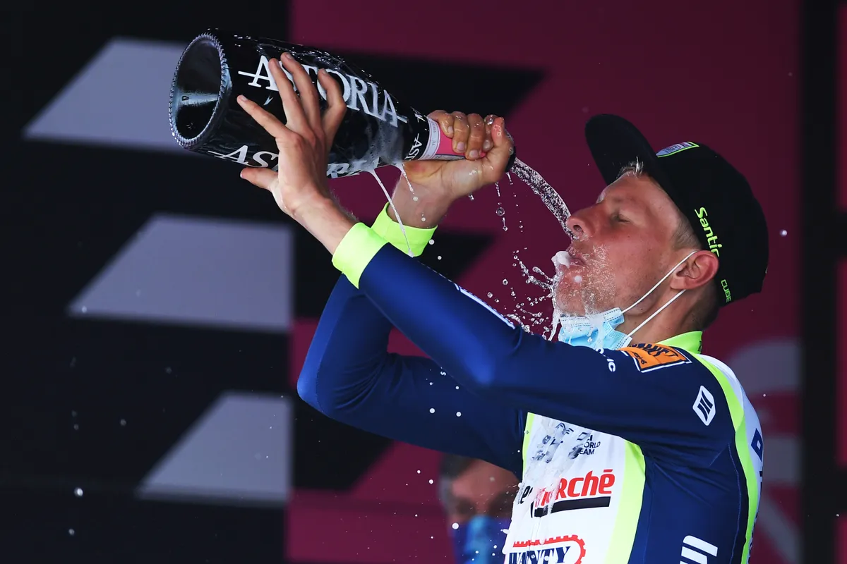 CANALE, ITALY - MAY 10: Taco Van Der Hoorn of Netherlands and Team Intermarché - Wanty - Gobert Matériaux celebrates at podium during the 104th Giro d'Italia 2021, Stage 3 a 190km stage from Biella to Canale / Trophy / Champagne / @girodiitalia / #Giro / on May 10, 2021 in Canale, Italy. (Photo by Tim de Waele/Getty Images)