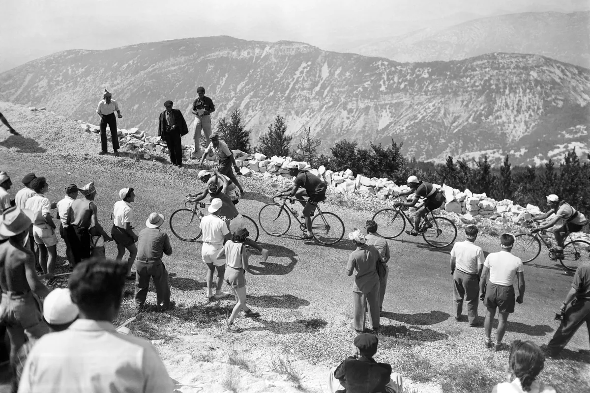French cyclist Raphaël Geminiani followed by the Swiss Hugo Koblet and the Italian Gino Bartali are in action on a mountain road in the Ventoux during the 17th stage of the Tour de France 1951 between Montpellier and Avignon, on July 22, 1951. (Photo by - / AFP) (Photo by -/AFP via Getty Images)