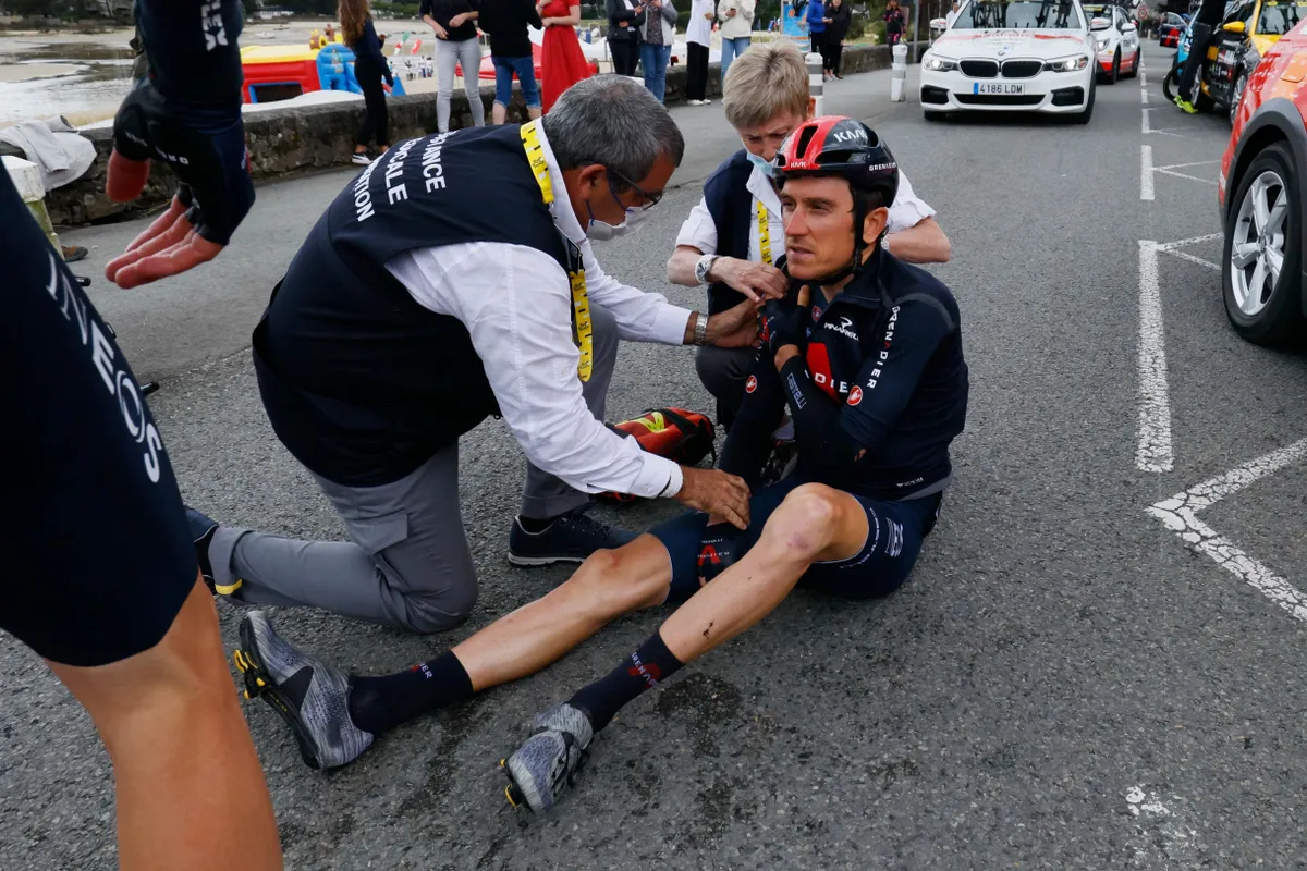 Team Ineos Grenadiers' Geraint Thomas of Great Britain receives medical treatment after crashing during the 3rd stage of the 108th edition of the Tour de France cycling race, 182 km between Lorient and Pontivy, on June 28, 2021. (Photo by Thomas SAMSON / AFP) (Photo by THOMAS SAMSON/AFP via Getty Images)