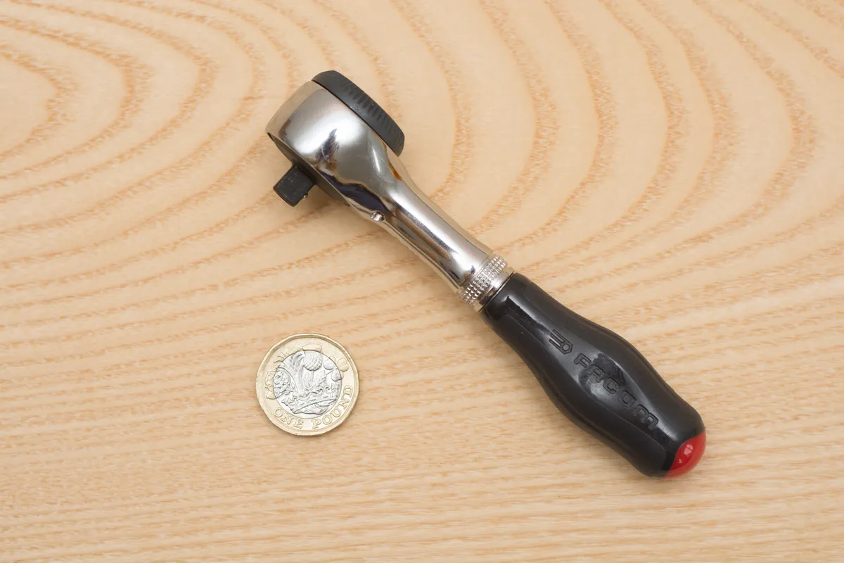 Small ratchet with pound coin for scale