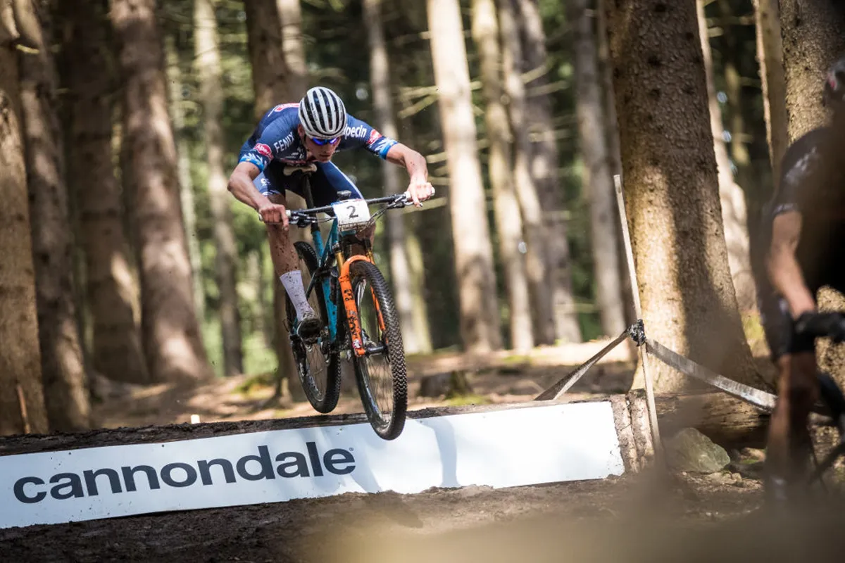 Mathieu van der Poel going over a jump at the UCI cross-country world championships in May 2021