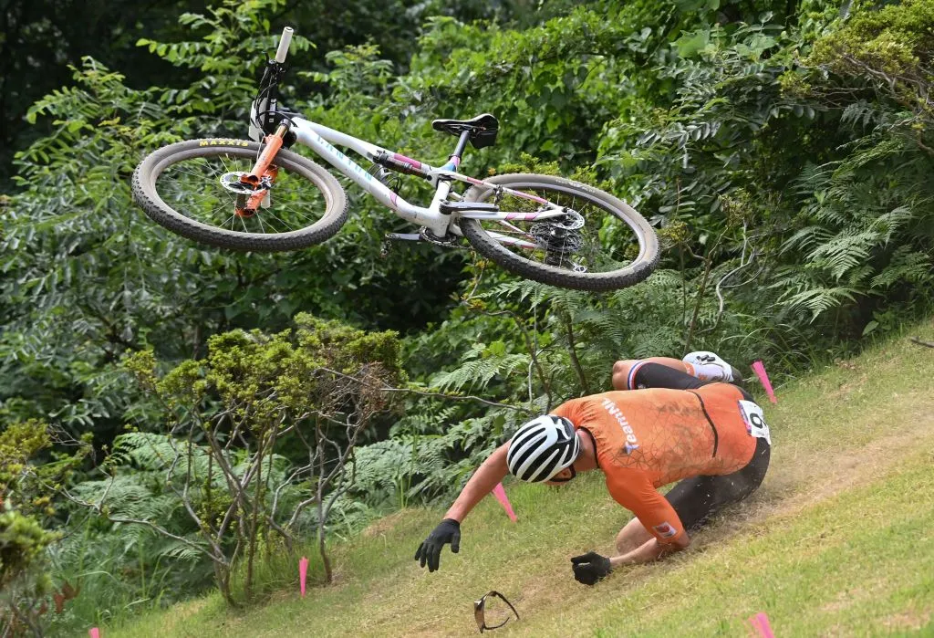 Netherlands' Mathieu Van Der Poel crashes during the cycling mountain bike men's cross-country event during the Tokyo 2020 Olympic Games at the Izu MTB Course in Izu on July 26, 2021