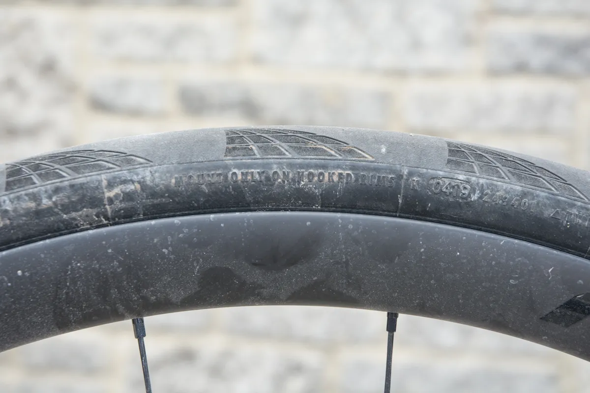 Continental tyre on rim with warning about using hooked rims only