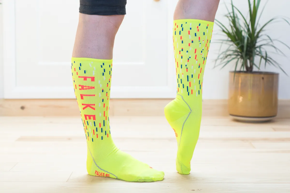 Hi-vis yellow cycling socks on model