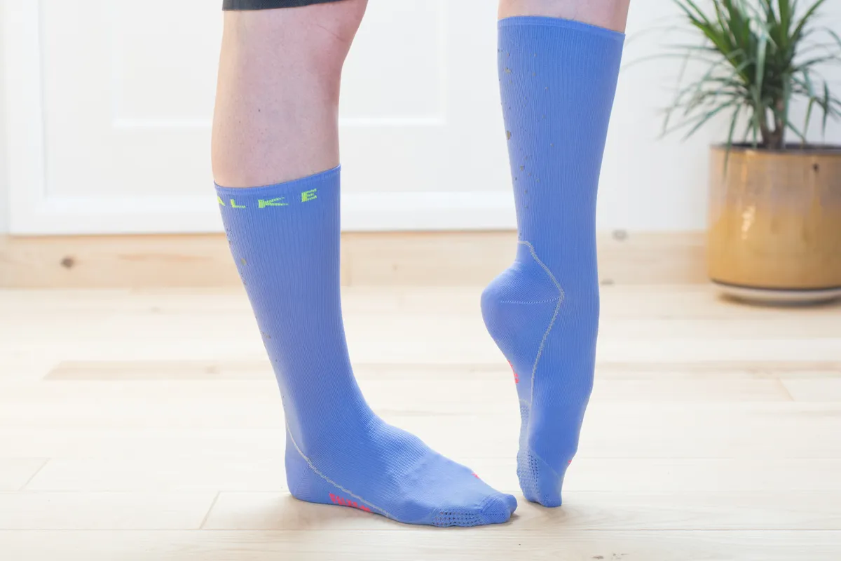 Blue cycling socks on model