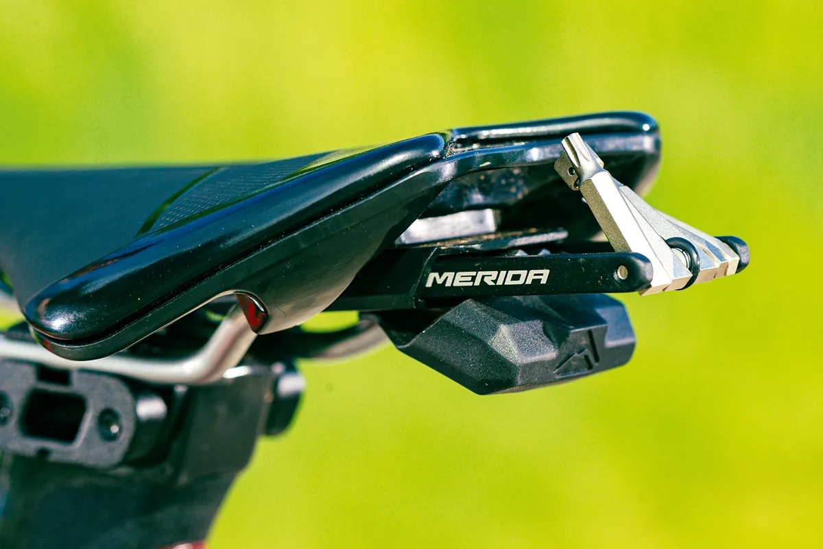 Merida Expert CC saddle houses a multi-tool for mechanicals.