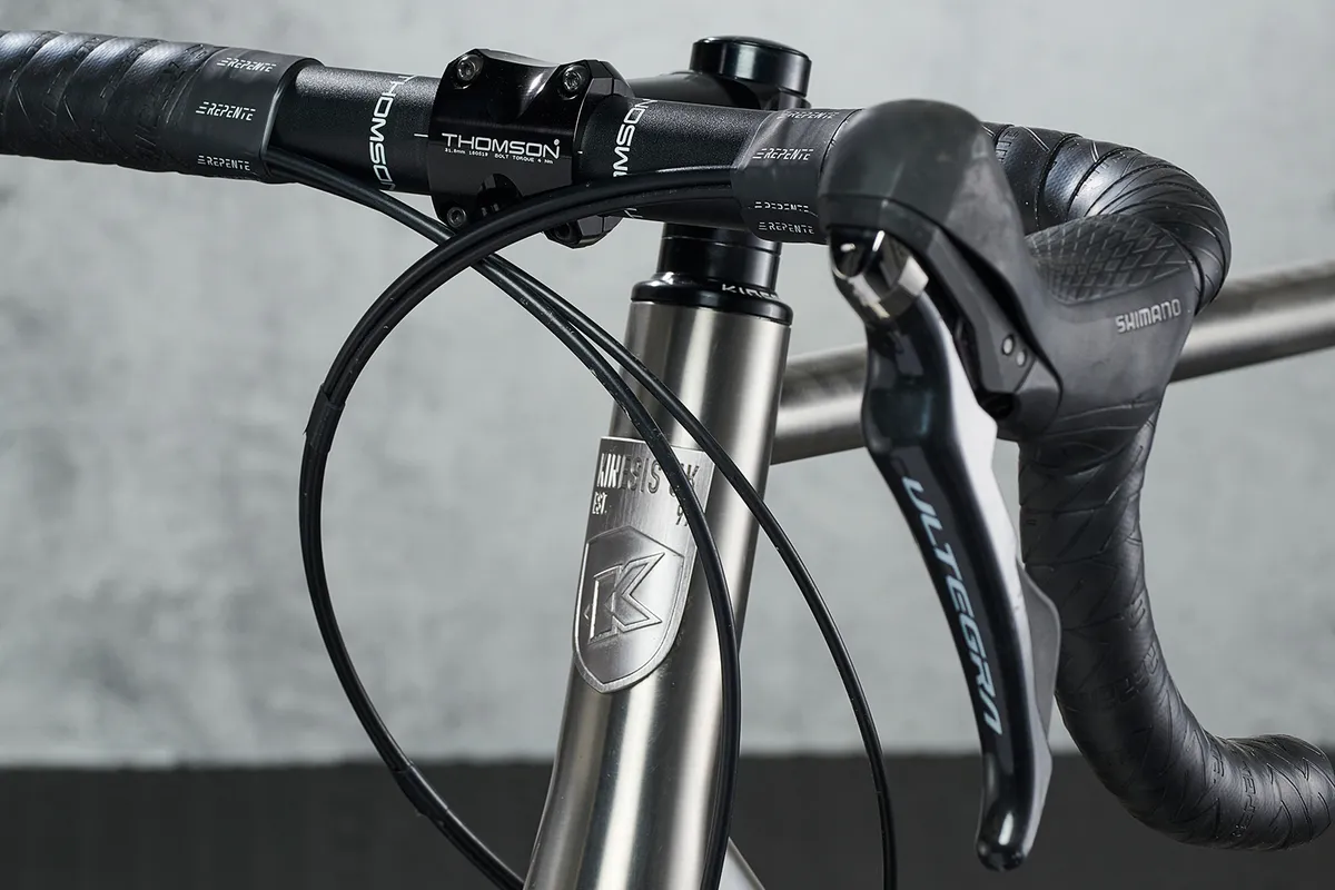 The titanium headtube badge on the Kinesis GTD V2 matches the perfect brushed-titanium finish of the frame