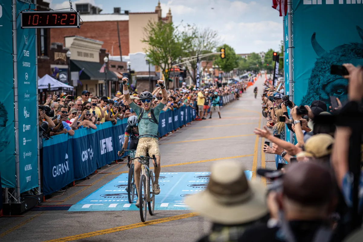 Ian Boswell crossing the finish line to win the 2021 Unbound gravel race