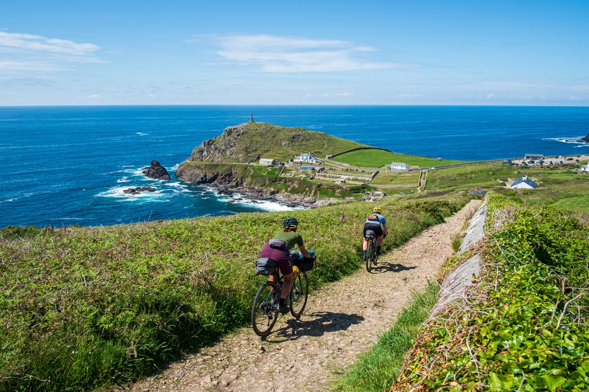 Vedangi Kulkarni (freelance) and Katherine Moore (Unpaved podcast) concentrate on the gravel descent down to Cape Cornwall during a recce ride of Cycling UK's West Kernow Way, June 2021. The 230km route is part of the EU-funded EXPERIENCE project to develop sustainable year-round tourism activities in Cornwall.