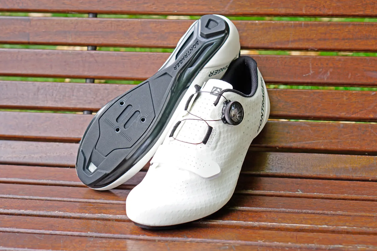 Bontrager Circuit road shoes photographed with one showing the shoe's upper and the other upside down to show the sole.