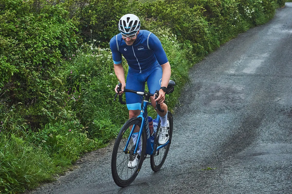 Male cyclist riding through Cornwall