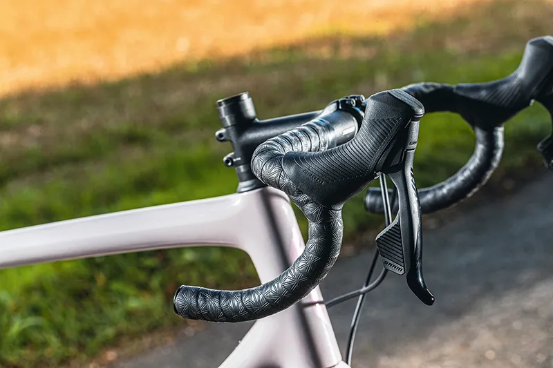 The Specialized Aethos Comp road bike is equipped with its own branded handlebar