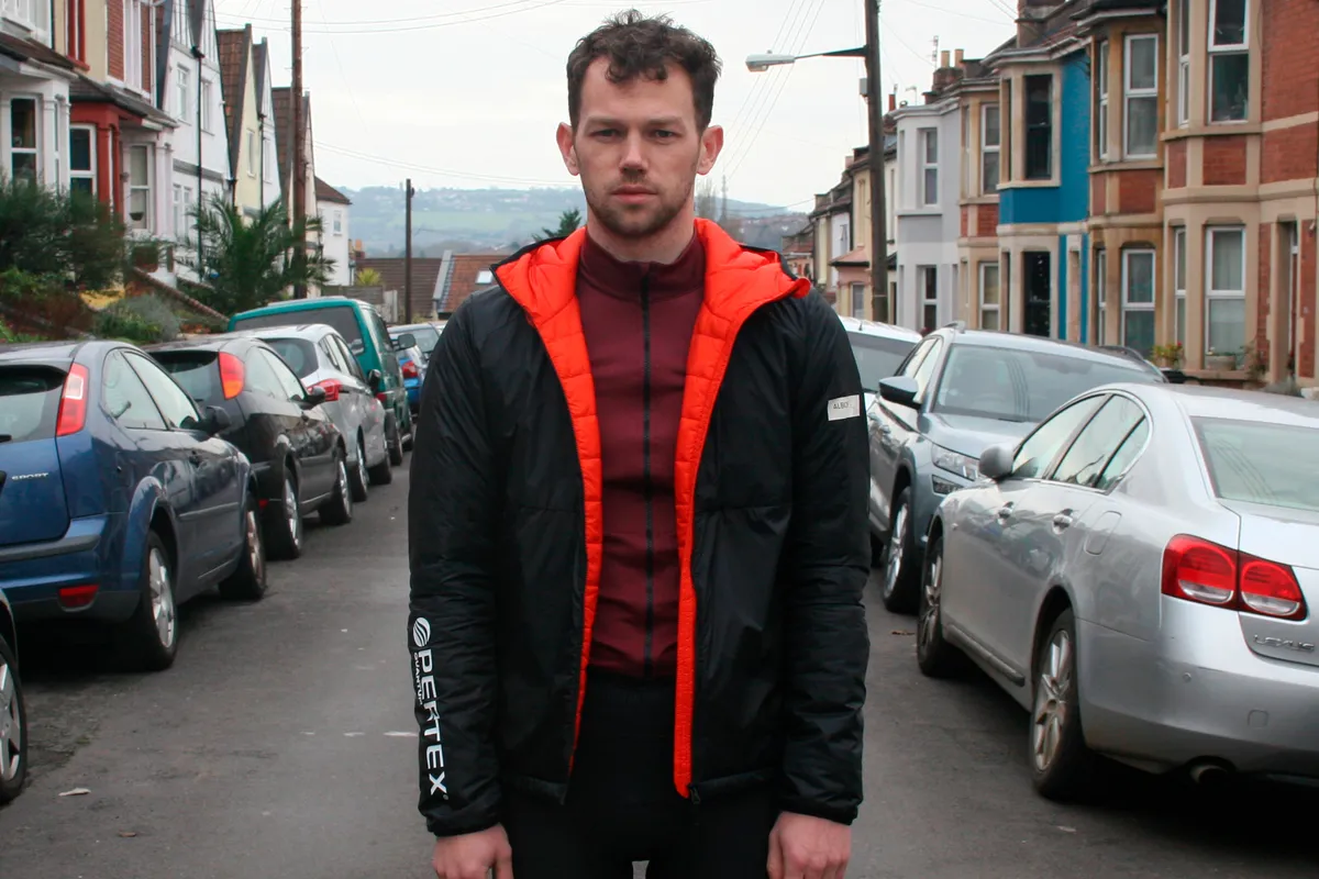 Stan Portus wearing black and orange Albion Zoa puffer jacket