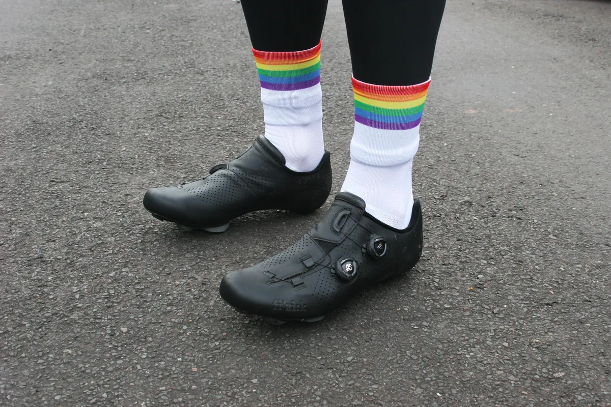 White socks with rainbow cuff at the top.