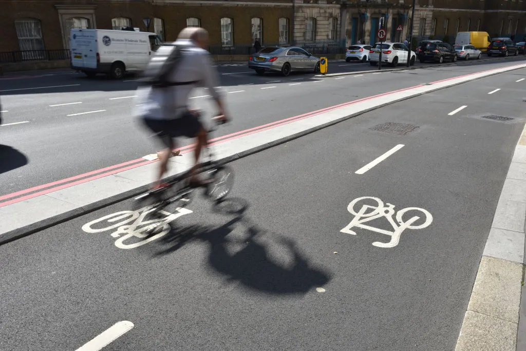 Cyclist riding in a cycle lane in London