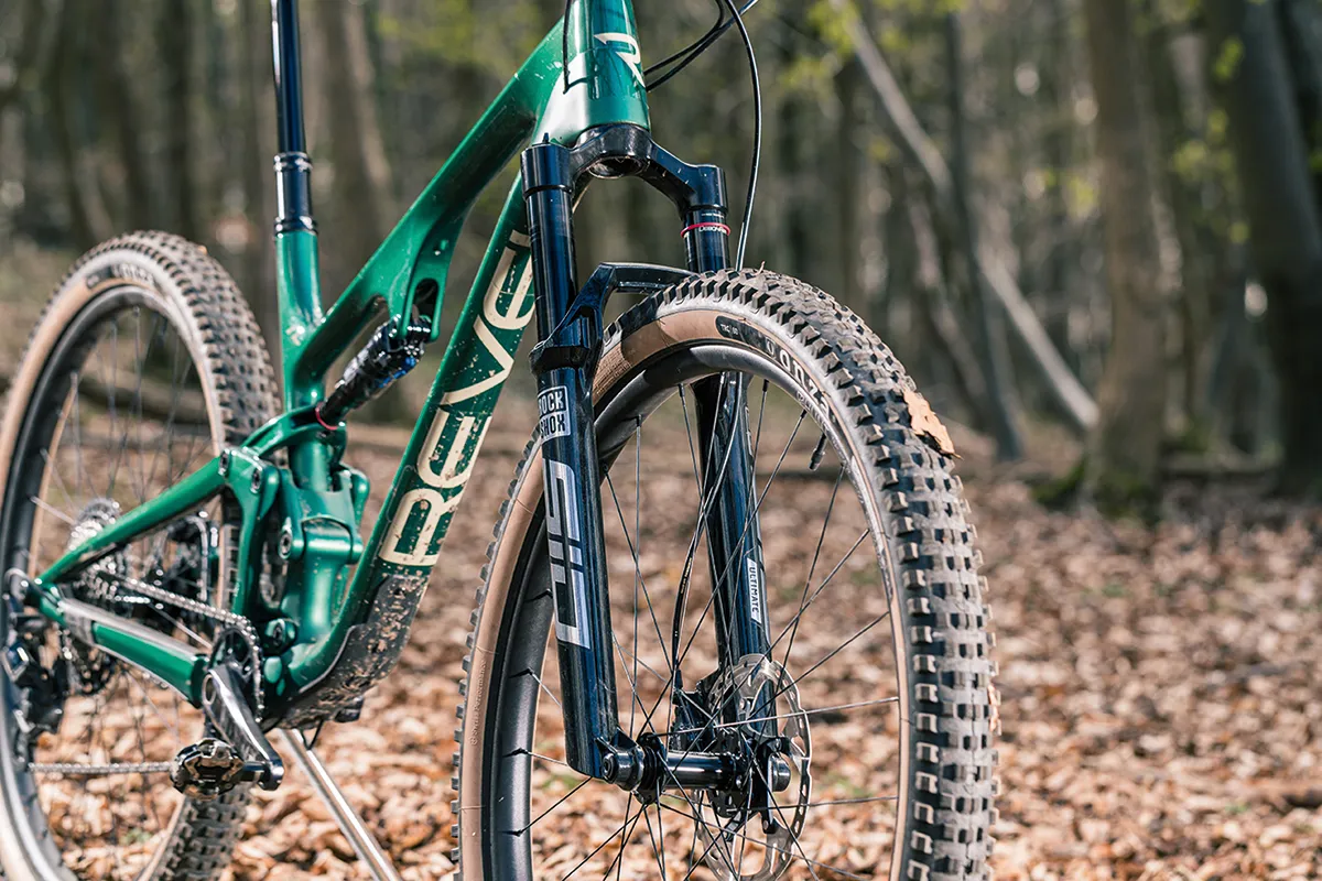 The Revel Ranger 29XT full suspension mountain bike is equipped with a RockShox SID Ultimate fork