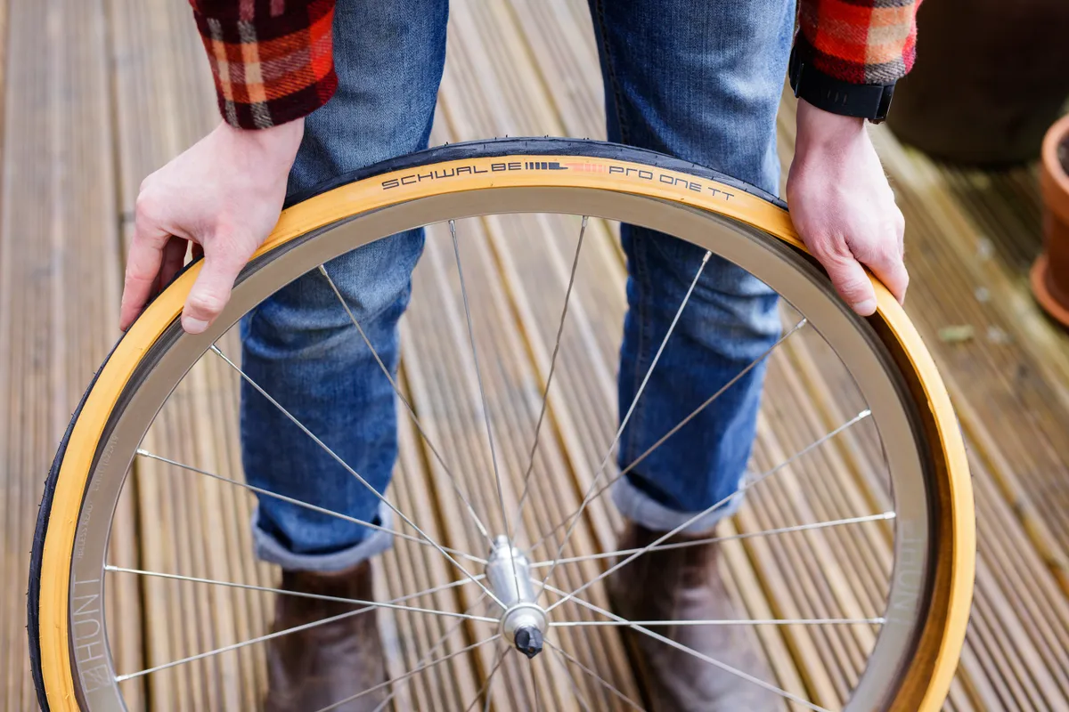 Person fitting a bicke tyre