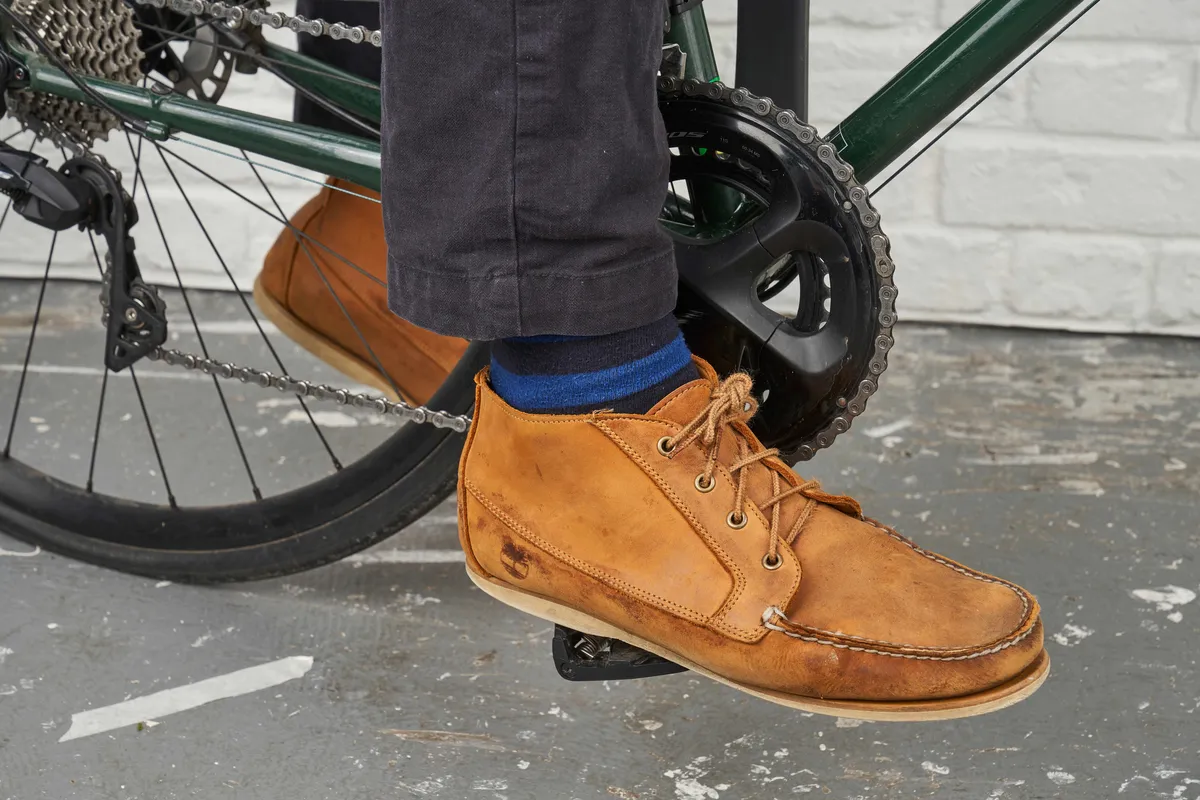 brown shoe on bike pedal