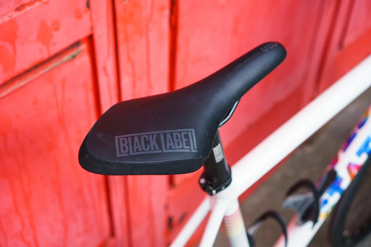Black Label saddle against a red background