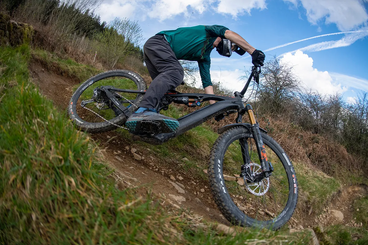 Male cyclist riding the Whyte E-180 RS v3 full suspension eMTB