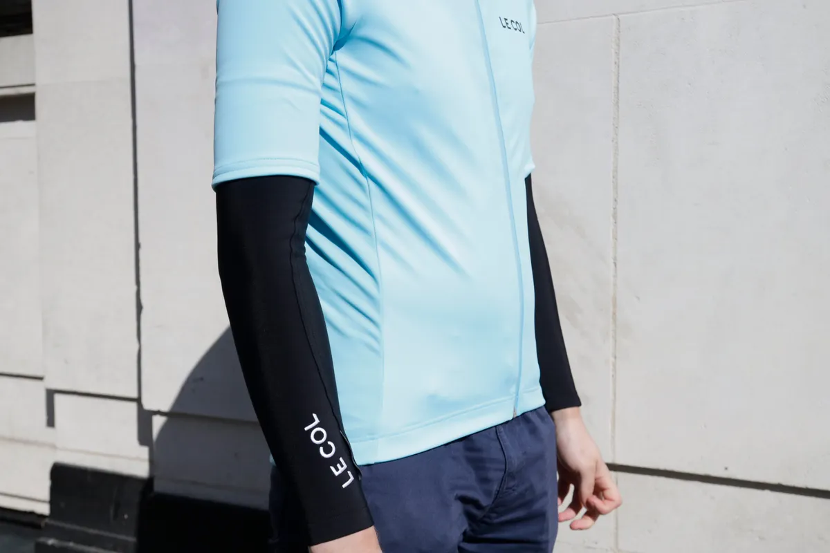 Le Col Pro All Weather jersey and arm warmers being modelled against a grey background