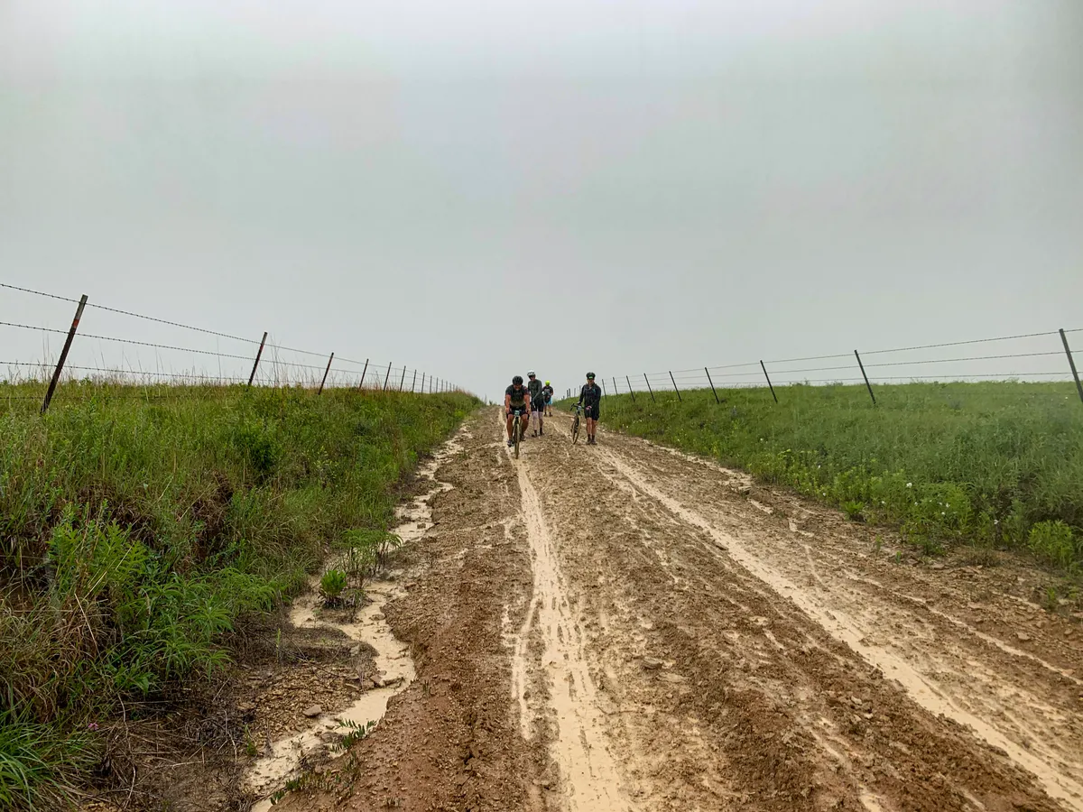 Muddy roads during the 2022 Unbound 100 gravel race