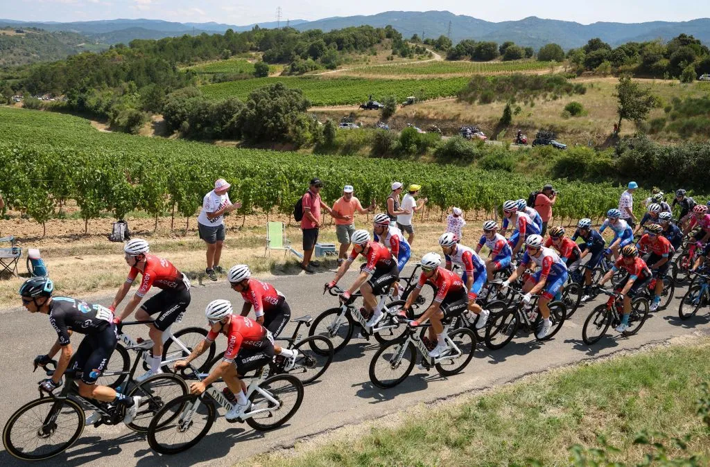 The pack of riders cycles during the 16th stage of the 109th edition of the Tour de France cycling race, 178,5 km between Carcassonne and Foix in southern France, on July 19, 2022. (Photo by Thomas SAMSON / AFP) (Photo by THOMAS SAMSON/AFP via Getty Images)