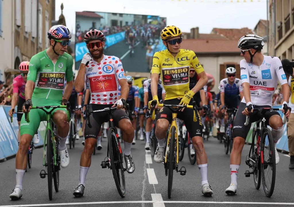 Jumbo-Visma team's Belgian rider Wout Van Aert wearing the sprinter's green jersey (L), Cofidis team's German rider Simon Geschke wearing the climber's dotted jersey (2nd L), Jumbo-Visma team's Danish rider Jonas Vingegaard wearing the overall leader's yellow jersey (2nd R) and UAE Team Emirates team's Slovenian rider Tadej Pogacar wearing the best young rider's white jersey (R) await the start of the 19th stage of the 109th edition of the Tour de France cycling race, 188,3 km between Castelnau-Magnoac and Cahors, in southwestern France, on July 22, 2022.