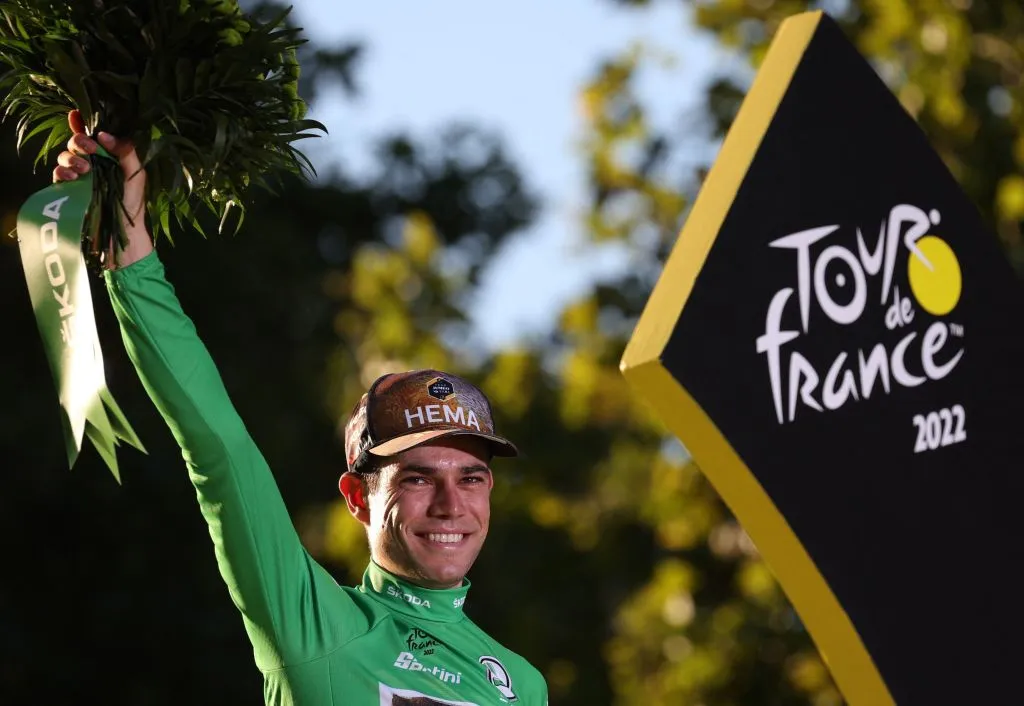 Jumbo-Visma team's Belgian rider Wout Van Aert celebrates on the podium with the sprinter's green jersey after the 21st and final stage of the 109th edition of the Tour de France cycling race, 115,6 km between La Defense Arena in Nanterre, outside Paris, and the Champs-Elysees in Paris, France, on July 24, 2022. (Photo by Thomas SAMSON / AFP) (Photo by THOMAS SAMSON/AFP via Getty Images)