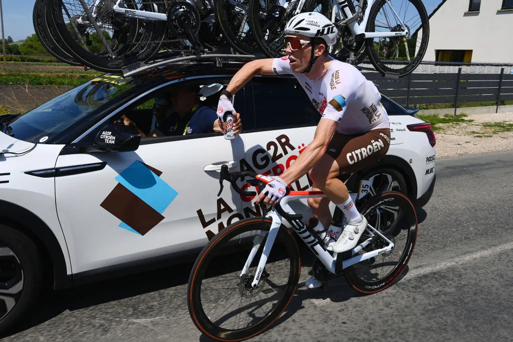 CALAIS, FRANCE - JULY 05: Stan Dewulf of Belgium and AG2R Citröen Team picks bottles from the Team car during the 109th Tour de France 2022, Stage 4 a 171,5km stage from Dunkerque to Calais / #TDF2022 / #WorldTour / on July 05, 2022 in Calais, France. (Photo by Tim de Waele/Getty Images)