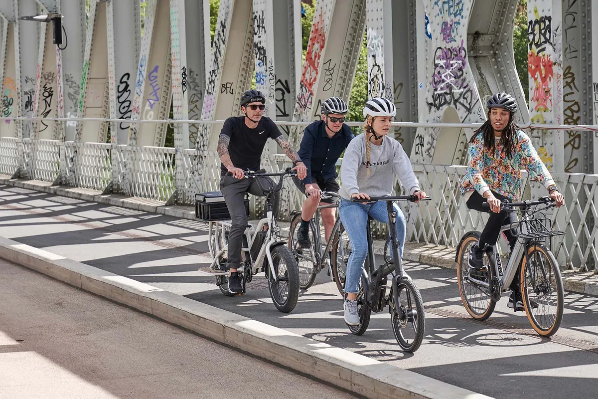 group of cyclists riding electric bikes