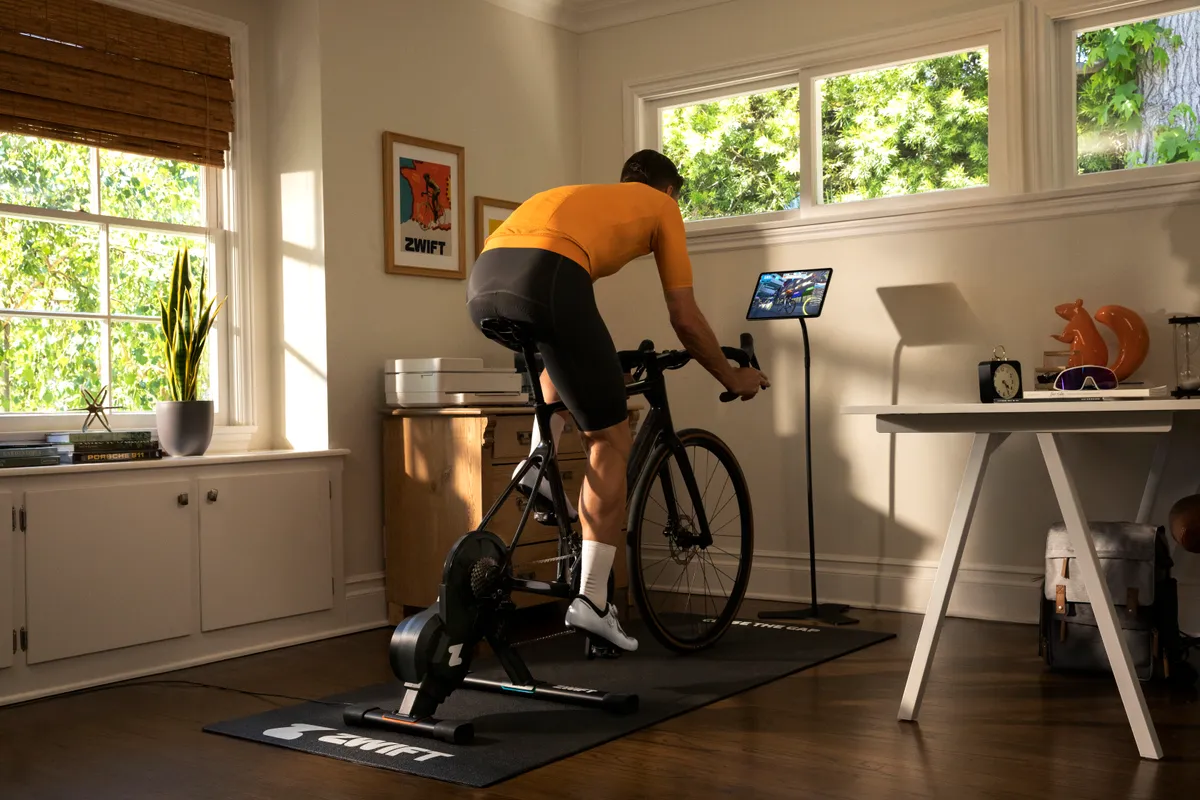 Cyclist using the Zwift Hub smart trainer at home