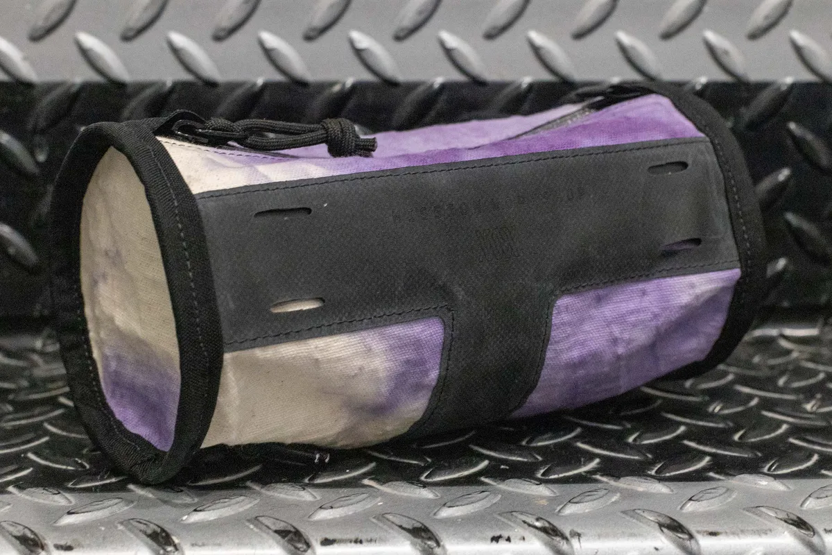 Mission Workshop handlebar bag in white and purple front angle.