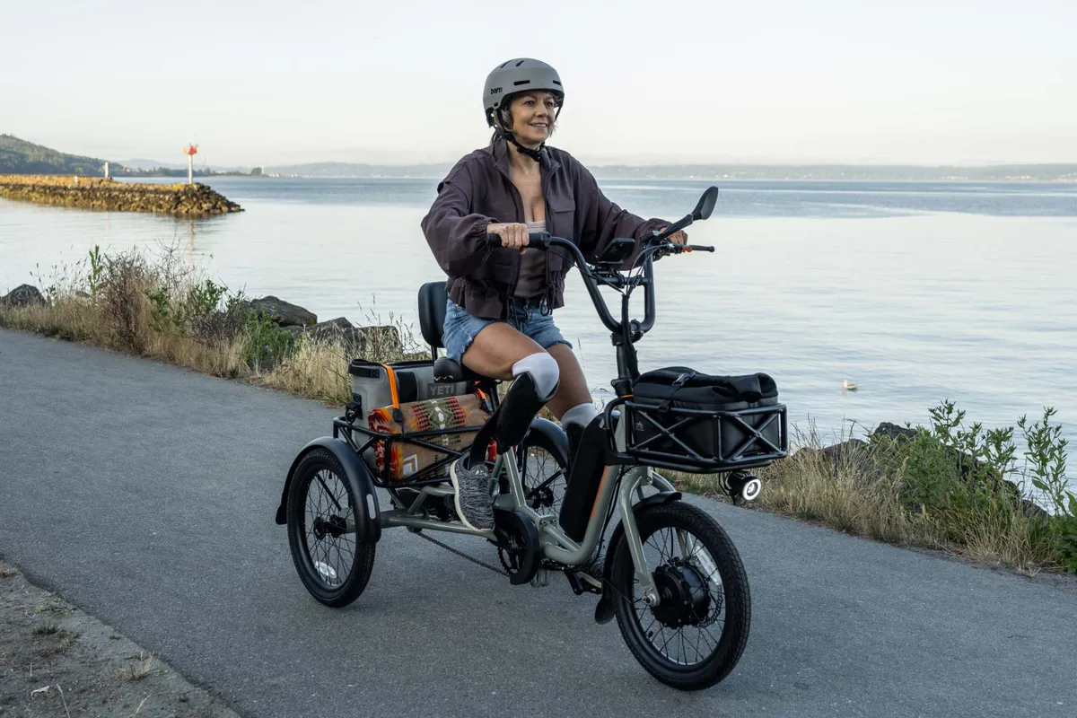 Woman riding Rad Power Bikes electric tricycle.