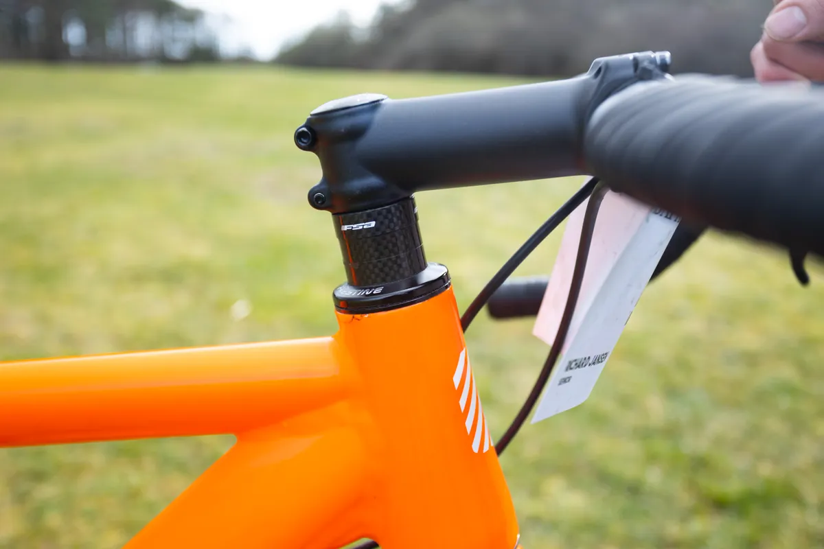 Spacers under stem on orange beach racing bike