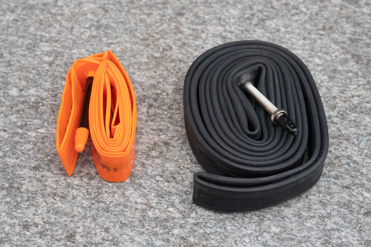 Tubulito S-Road inner tube and conventional butyl tube together on a rock