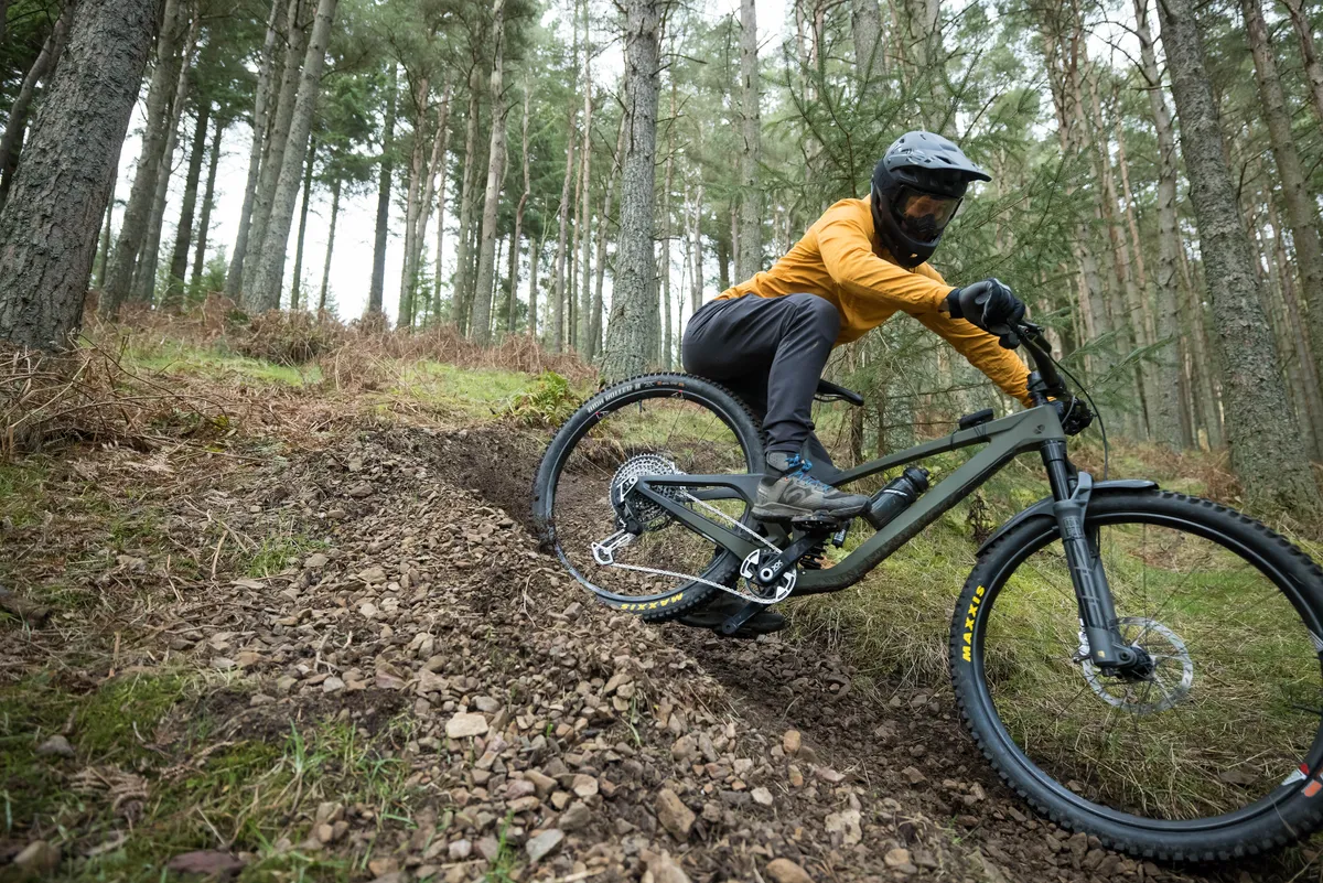 Male mountain biker Alex Evans riding a We Are One Arrival 152 enduro mountain bike fitted with SRAM's XX T-Type Eagle Transmission Powermeter AXS groupset