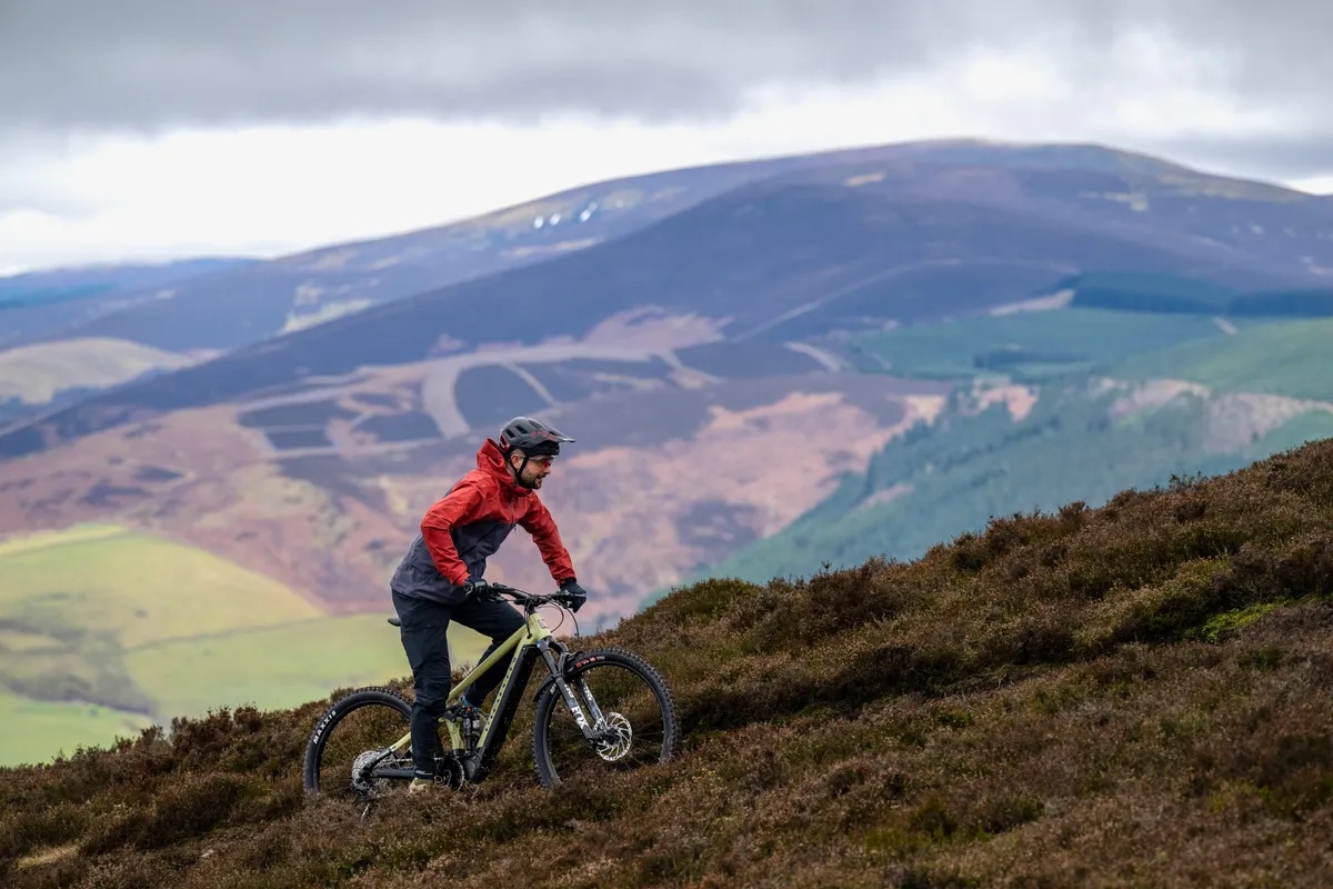 2023 Marin Rift Zone E2 electric mountain bike ridden by male mountain bike Alex Evans on the reservoir climb at the Golife, Scotland, UK.