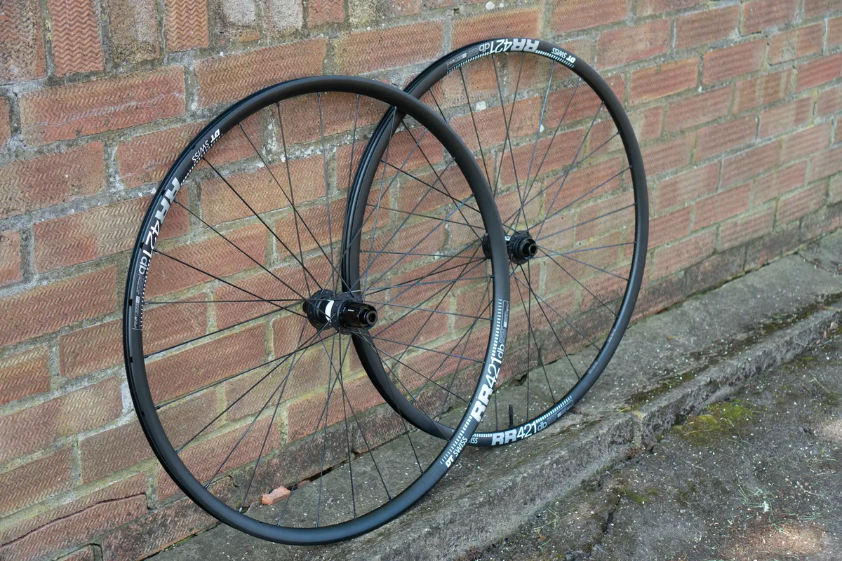 DT Swiss RR421 rims on 350 hubs against a wall