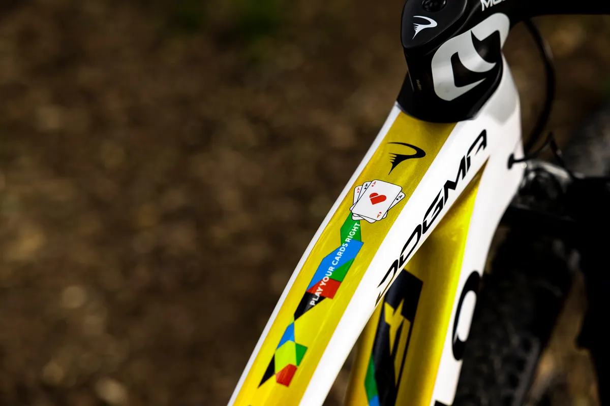 Pinarello Dogma XC top tube with 'Play your cards right' motto.