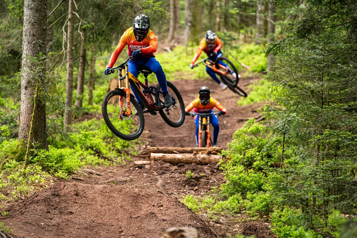 Giant Factory Racing downhill team following each other on the Giant Gory Advanced.