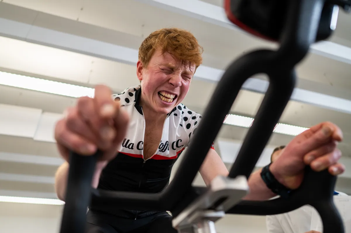 Jack Evans riding Wattbike with contorted expression