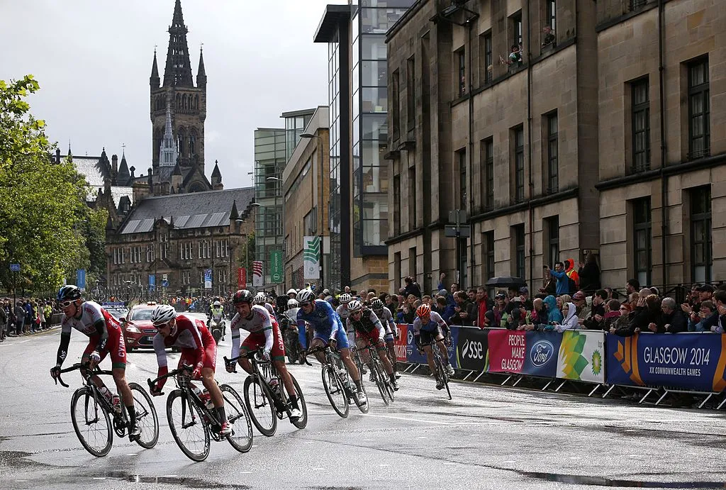 Wales' Geraint Thomas (L) takes a corner during the men's cycling road race during the 2014 Commonwealth Games in Glasgow, Scotland on August 3, 2014. AFP PHOTO / ADRIAN DENNIS (Photo credit should read ADRIAN DENNIS/AFP via Getty Images)