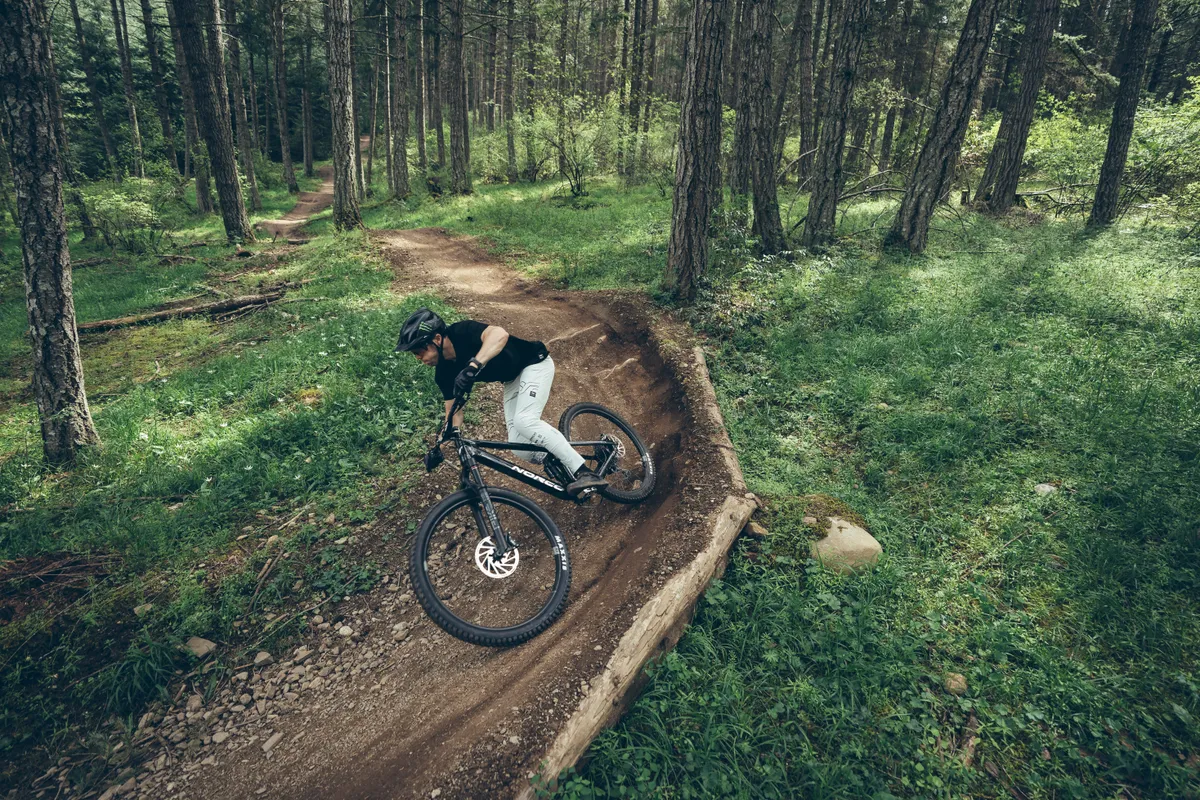 2024 Norco Fluid being ridden by male cyclist round berm