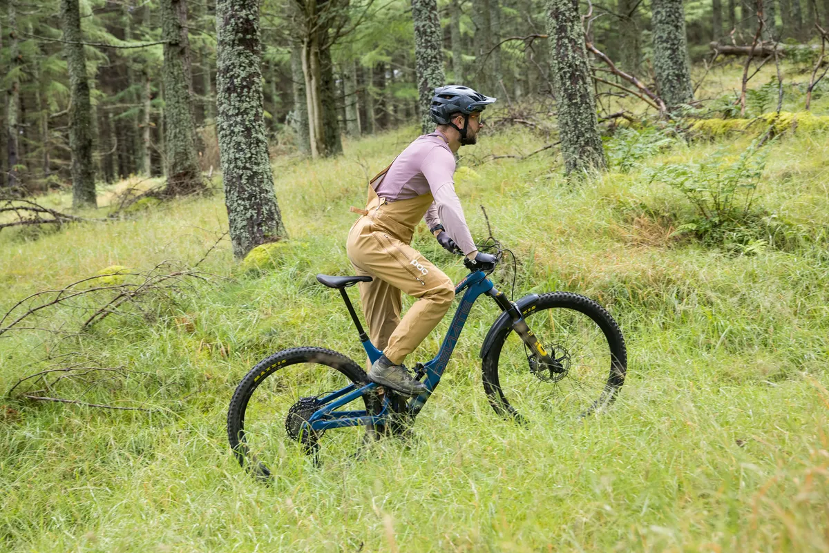Deviate Highlander II high pivot trail mountain bike ridden by male mountain bike tester Alex Evans on a trail called Green Wing in Scotland's Tweed Valley in the UK.