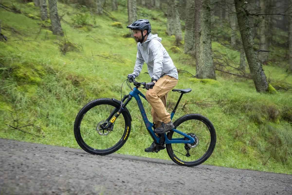 Deviate Highlander II high pivot trail mountain bike ridden by male mountain bike tester Alex Evans on a trail called Too Hard For EWS in Scotland's Tweed Valley in the UK.