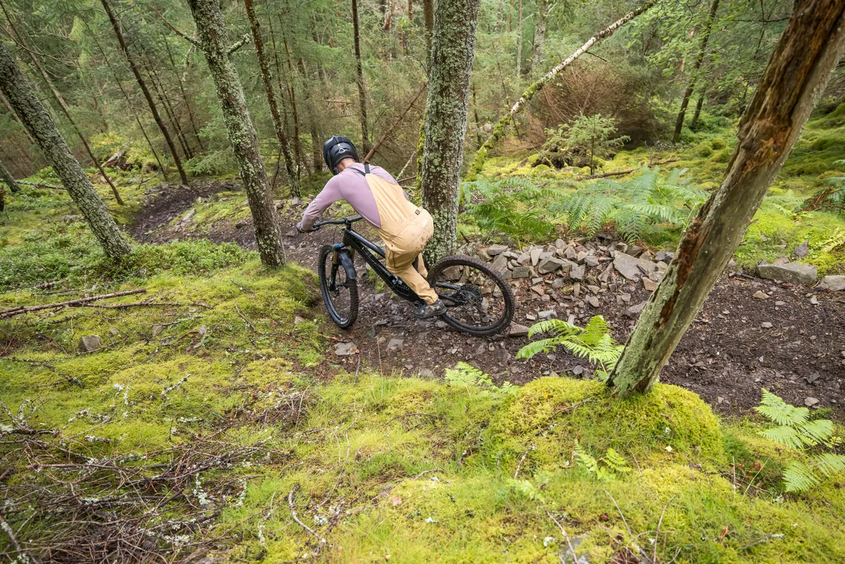 Norco Range C1 high pivot trail mountain bike ridden by male mountain bike tester Alex Evans on a trail called Too Hard For EWS in Scotland's Tweed Valley in the UK.