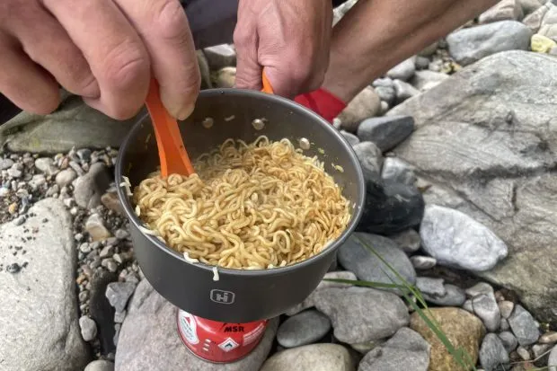 Cooking noodles in camping stove